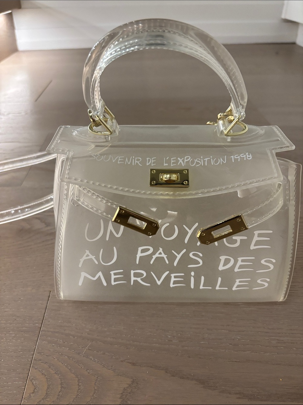 Transparent Mini Top-Handle Bag with White Script & Gold Hardware